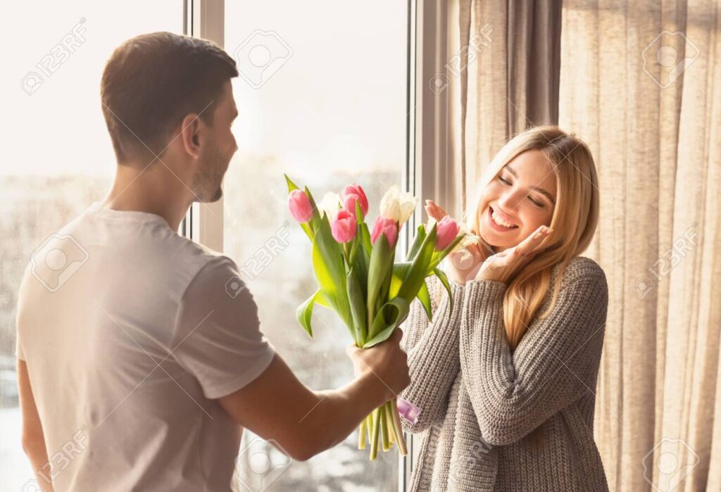 Giving flowers to her images